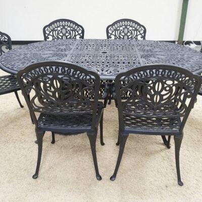 1085	7 PIECE CAST METAL PATIO SET, TABLE IS 72 IN X 48 IN, 6 ARM CHAIRS, INCLUDES UMBRELLA HOLDER
