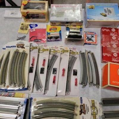 #1228 â€¢ HO Scale Tracks, Crossing Gate, Freight Station, Truck
Lionel automatic gateman 145, Bachman tracks, MRC sound station 312,...