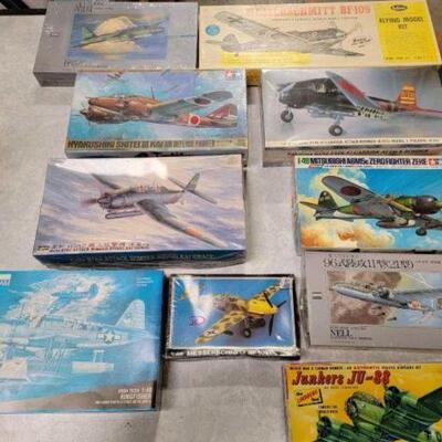 #1240 â€¢ 10 Model Planes: Brands include Monogram, Hasegawa, ARII, Starlix, Guillows, Lindberg, and Tamiya.