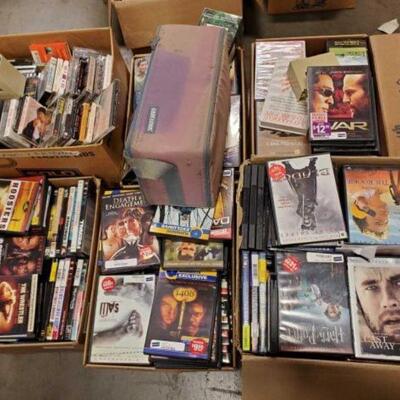 #4940 â€¢ 6 Boxes Of Dvd's, Cassettes, VCR'S, And Cd's  Includes Shirley Temple, Snow White, Anaconda, Saw, Princess...