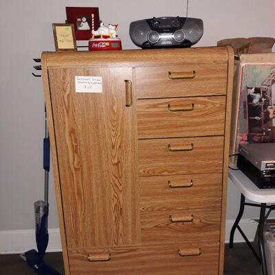 gentlemen's closet that matches the nightstand, cd player/radio, and more.