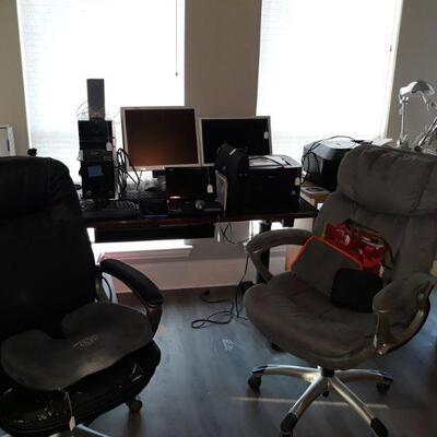 Electric desk for sit to stand, office chairs, seat cushions, and office supplies.