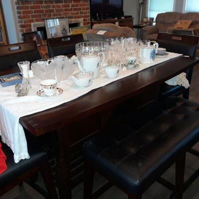 bar height table with bench and four stools, nice dishes
