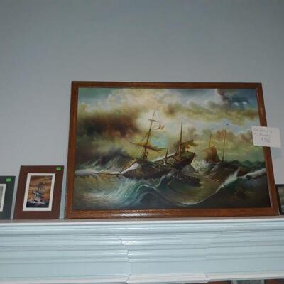 nautical prints and an oil painting by T. Slowsky.
