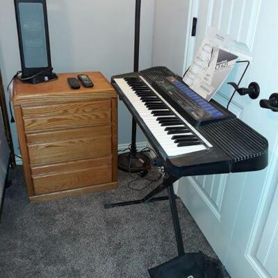 Casio keyboard and nightstand that is part of a set with two chest of drawers