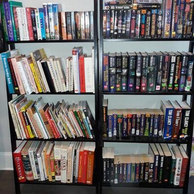 bookshelves, cookbooks, and many Sci-Fi books.