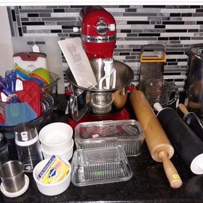 New condition Kitchen-Aid stand mixer and other baking supplies.