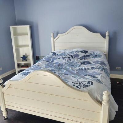 One of two matching queen beds