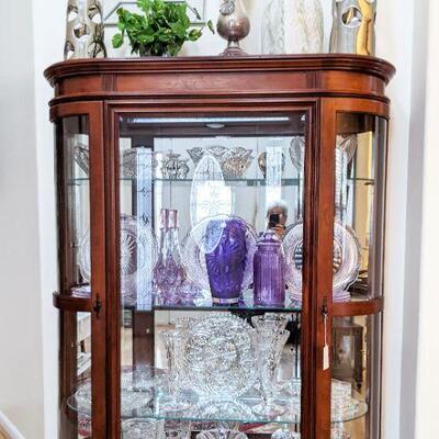 Beautiful maogany curved glass curio cabinet - lighted with glass shelves
