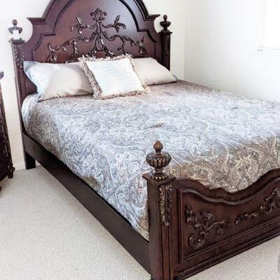 Queen size walnut bed with handcarved relife on headboard and footboard