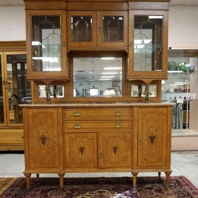 1017	INLAID BIRDSEYE MAPLE MARBLE TOP SIDEBOARD, GLASS ON THE TWO TOP DOORS IS BEVELED. BRASS WINGED GRIFFINS SUPPORT THE TOP SECTION....