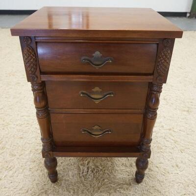 1010	3 DRAWER CHERRY NIGHTSAND TURNED 3/4 COLUMNS & TURNED FEET. 18 IN W, 13 IN DEEP, 27 IN H 
