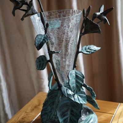 Metal art with vase insert of clear glass on marble plateau about 24