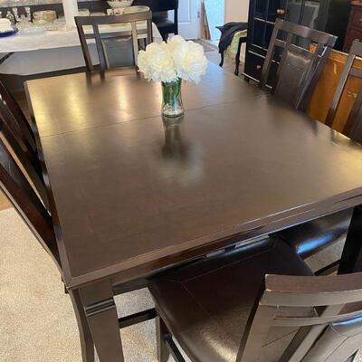 wood dining room table with 6 chairs and one leaf