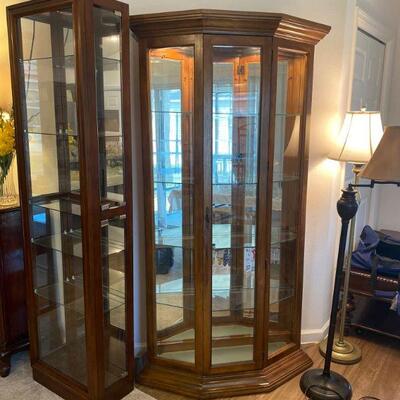 two curio cabinets