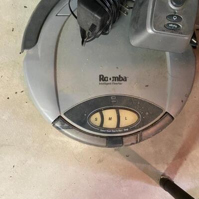 Roomba ..Has Charger. Its older version 