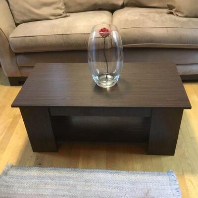 Coffee Table Top lifts for additional storage.