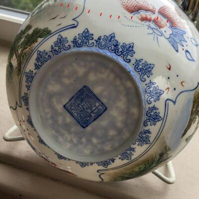 Eggshell Porcelain Bowl has a repair ( highlighted via the red dots)