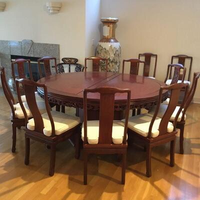 Rosewood Round Dining Table with 12 Chairs.