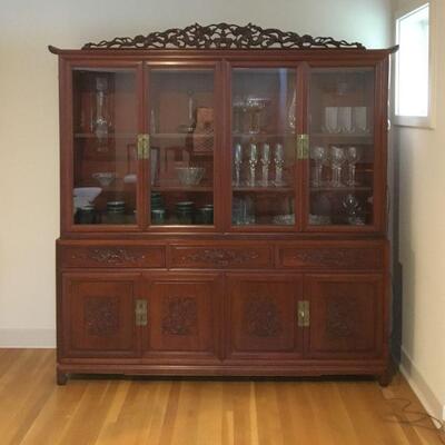 Rosewood China Cabinet with carved dragon motif. Measures 79in tall from highest crown point to floor and 75in wide. Top cabinet is 16in...