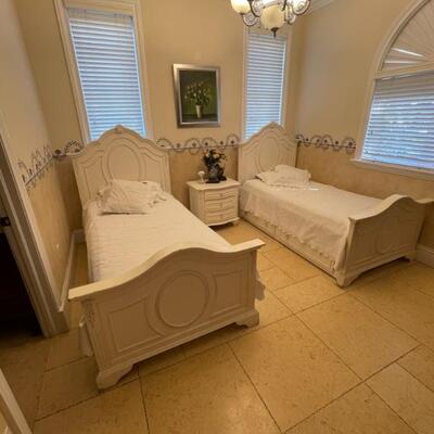 Beds have storage drawers under the mattress.