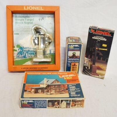 1202	LIONEL MODEL TRAIN ACCESSORIES/BUILDING KIT. LOT INCLUDES LIONEL HO ROTARY BEACON 5-4501, LIONEL HO BUILDING KIT ROOMING HOUSE,...