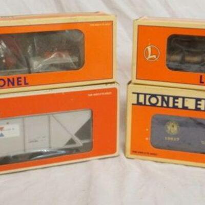 1029	LOT OF 4 LIONEL MODELS INCLUDES 3 TRAIN CARS & ALCOA COVERED HOPPER W/ ORIGINAL BOXES
