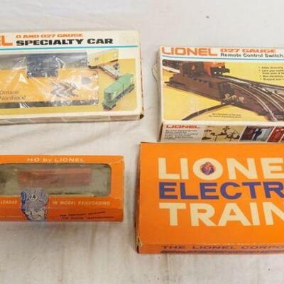1343	LOT OF LIONEL TRAINS/ACCESSORIES INCLUDES MANUAL SWITCHES, REMOTE CONTROL SWITCH, O & O 27 GAUGE MODEL & HO BY LIONEL MISSILE...