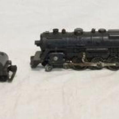 1329	MODEL TRAIN LOT INCLUDES 3 LOCOMOTIVES & ONE LIONEL TENDER. ONE LOCOMOTIVE IS MARKED LIONEL
