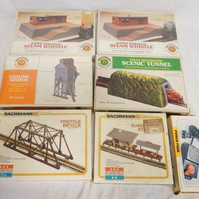 1223	LOT OF 6 BACHMANN BUILDING KITS PLUS A N-HO POWER BACK. 5 OF THE 6 KITS ARE SEALED IN BOX.
