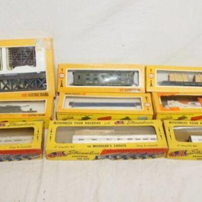 1332	LOT OF HO GAUGE MODEL TRAINS LOT INCLUDES FIVE COX MODELS & A BRIDGE & TRESTLE SET, & THREE O.K. STREMLINE PASSENGER CAR KITS
