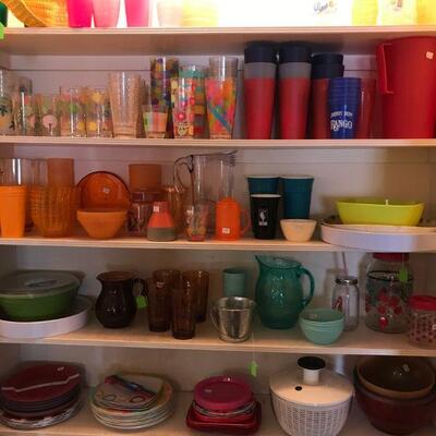 Closet full of poolside Colorful Plasticware