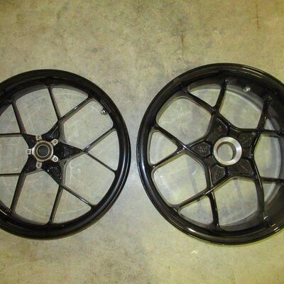 KTM ALUMINUM MOTORCYCLE RIMS: FRONT RIM MEASURES 3.5 X 17, NUMBERED 61309 001100, DOT E WITH MAX PSI OF 165KG AND BACK RIM MEASURES 6.0 X...
