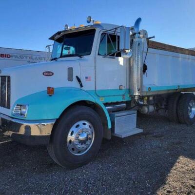 #100 â€¢ 1999 Peterbilt Model 330 Dump Truck OUT OF STATE BUYER ONLY 

SEE VIDEO!!

VIN: 1NPNHD7X7YS494858
Mileage: 76356
Caterpillar...