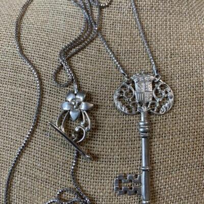 Sterling Silver Key Necklace with Coat of Arms -
38in chain w/ 2.5in Key