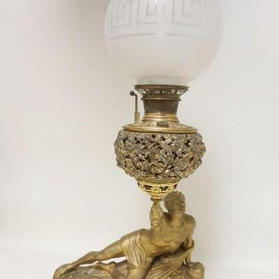 1033	BRADLEY & HUBBARD FIGURAL METAL LAMP, HAS FROSTED & CUT GLOBE, 30 1/2 IN TO TOP OF CHIMNEY X 16 1/2 IN WIDE
