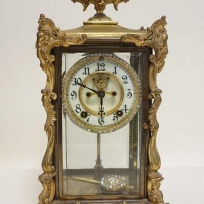 1066	ANSONIA VICTORIAN BRASS & GLASS CLOCK, HAS OPEN ESCAPEMENT, JEWELED FACE & PENDULUM, GLASS IS BEVELED, 8 1/4 IN WIDE X 7 1/4 IN DEEP...