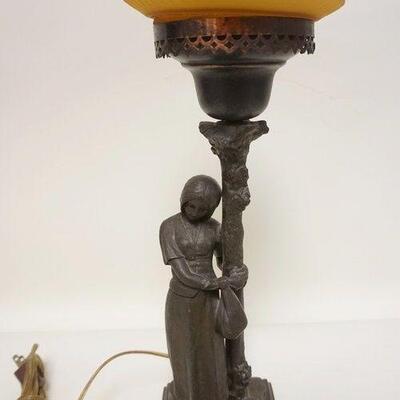1075	FIGURAL CAST METAL LAMP OF WOMAN W/ARMS AROUND TREE, CLUTCHING A BAG, 18 IN HIGH
