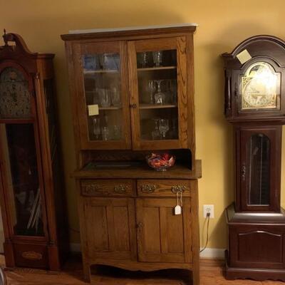 Antique 2 piece Oak hutch, grandfather clocks, glassware 
