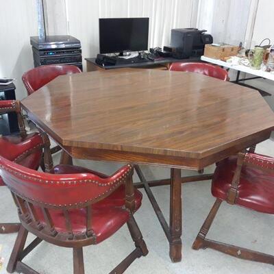 Vintage game table with 6 chairs. Felt poker and gaming under top.