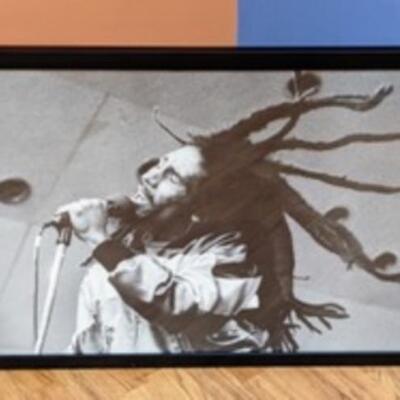 Framed Bob Marley Print. Measures 24” x 34”.