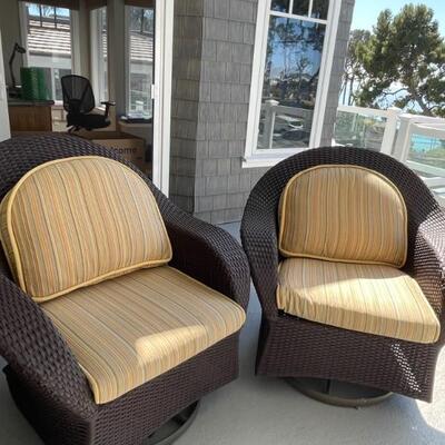 Pair of all weather wicker swivel chairs