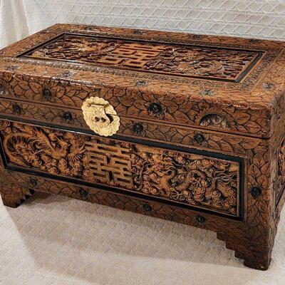 Carved wooden chest.  Carved on all sides.  19" (H), 17"  (D) and 34.5" (L).  Auction Item