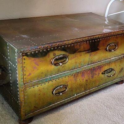 Wood chest covered with brass.  34 x 19.5 x 18 (T) inches.  uUction Item