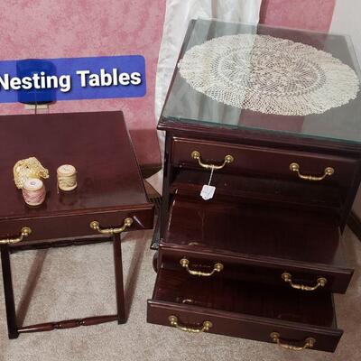 Cherry nesting tables neatly tuck into and end table. 