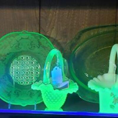 Fenton and other depression glass with radium under blacklight.