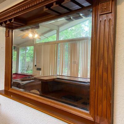 Mirror with overhead wine glass rack