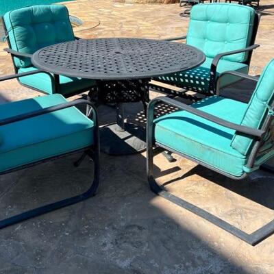 Patio Table with 4 Chairs ( damage to bottom)