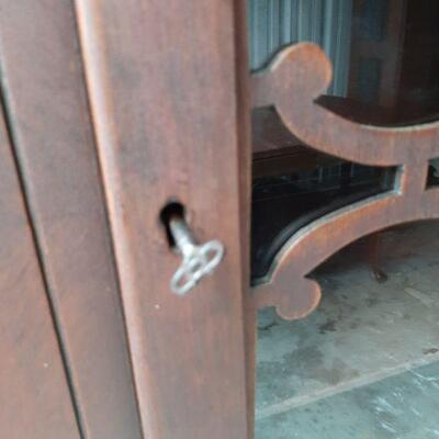 Close up picture of skeleton key lock on china hutch