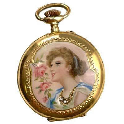 An Art Nouveau stamped 18K Swiss pocket watch. Front cover has enameled portrait of a maiden gazing upwards with a bough of roses, and...